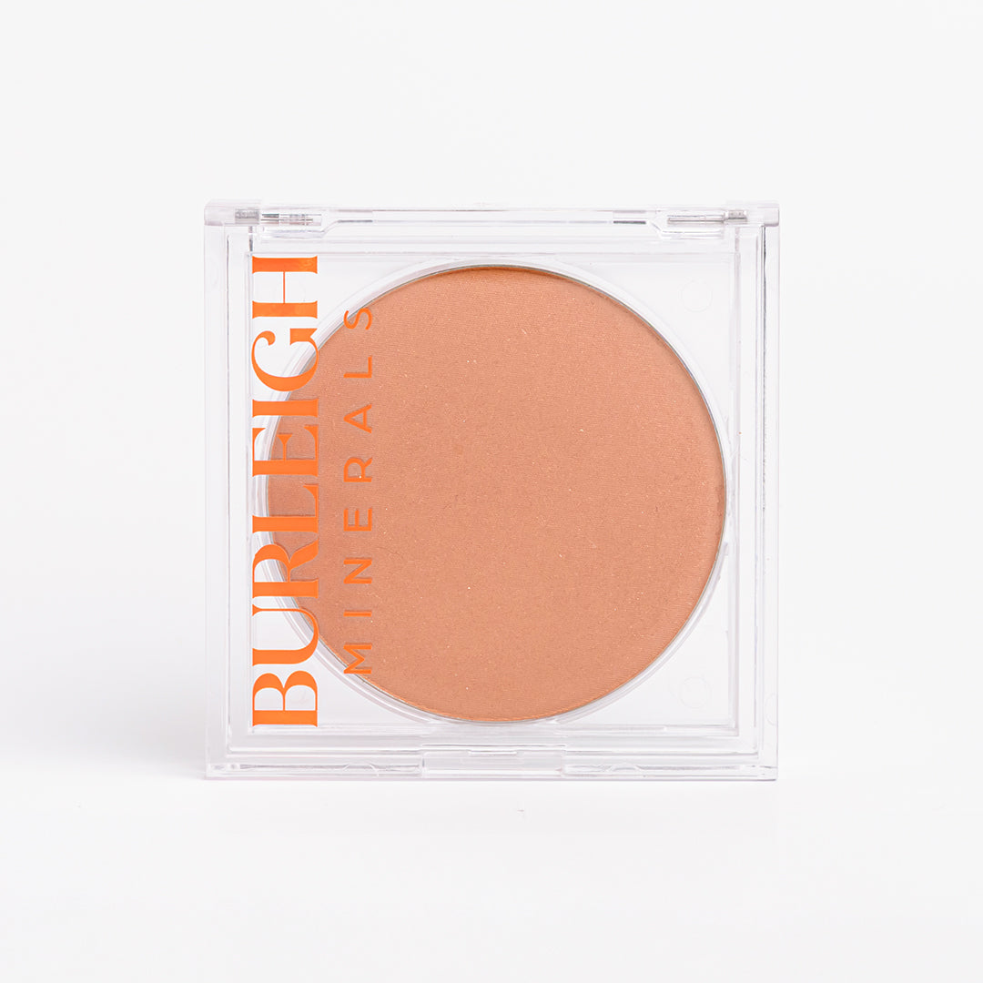 No-tox mineral bronzer in clear casing, photographed against a white background.