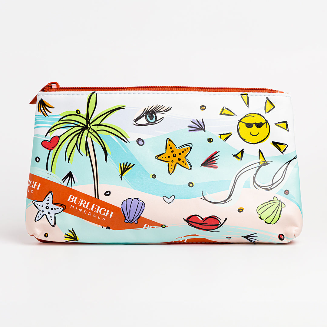 Colourful makeup bag that comes with vegan makeup brush set. Featuring bright blues and oranges, as well as colourful icons like sea shells, star fish, the sun and a palm tree