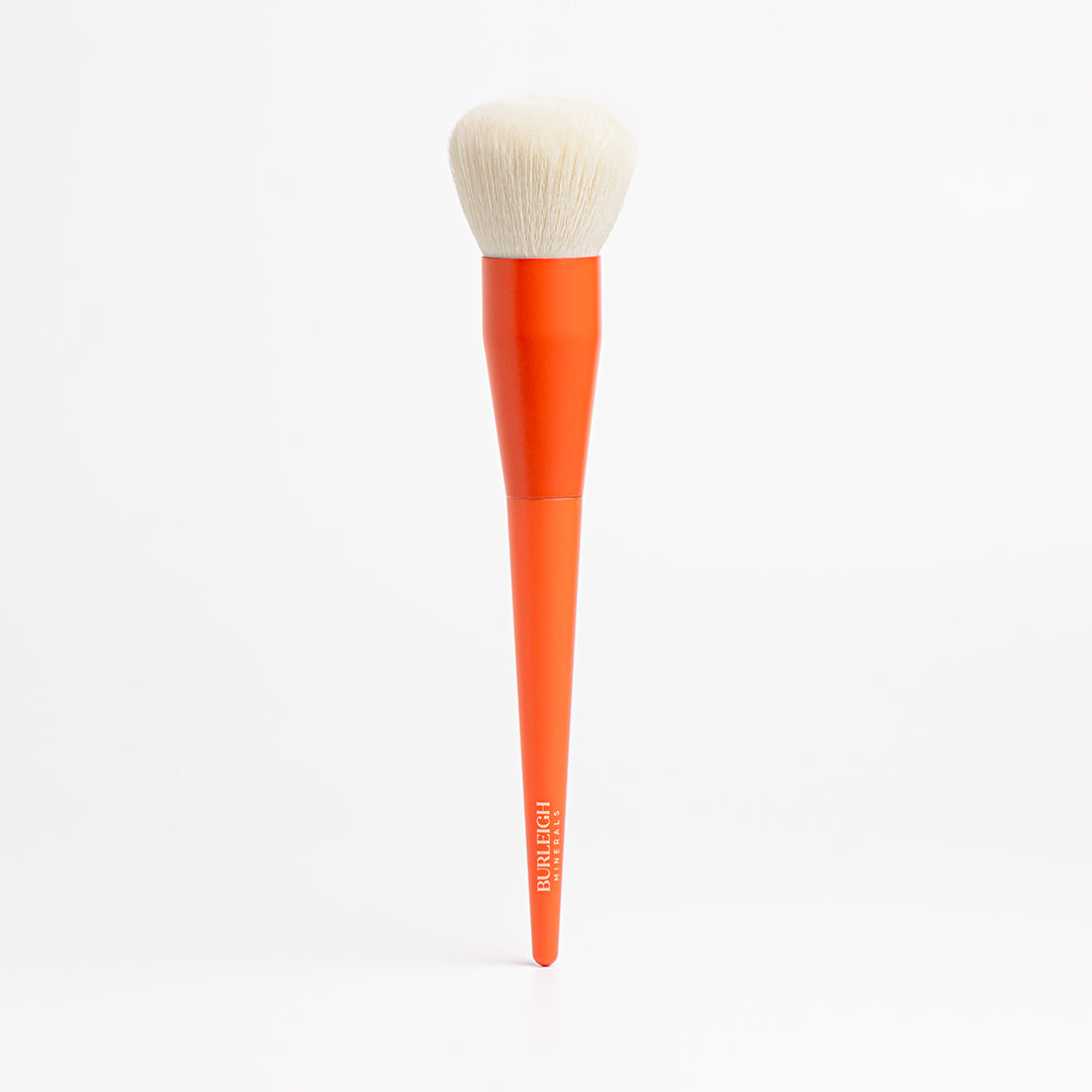 All Rounder vegan makeup Blending Brush with white bristles and an orange handle is ideal for liquid, cream or powder products to flawlessly blend pigments for an even, smooth finish