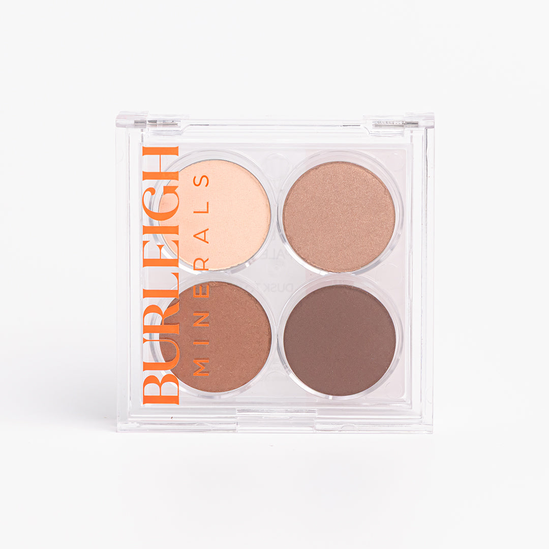 No-tox, mini eye shadow palette featuring four bronze shades in clear casing, photographed against a white background