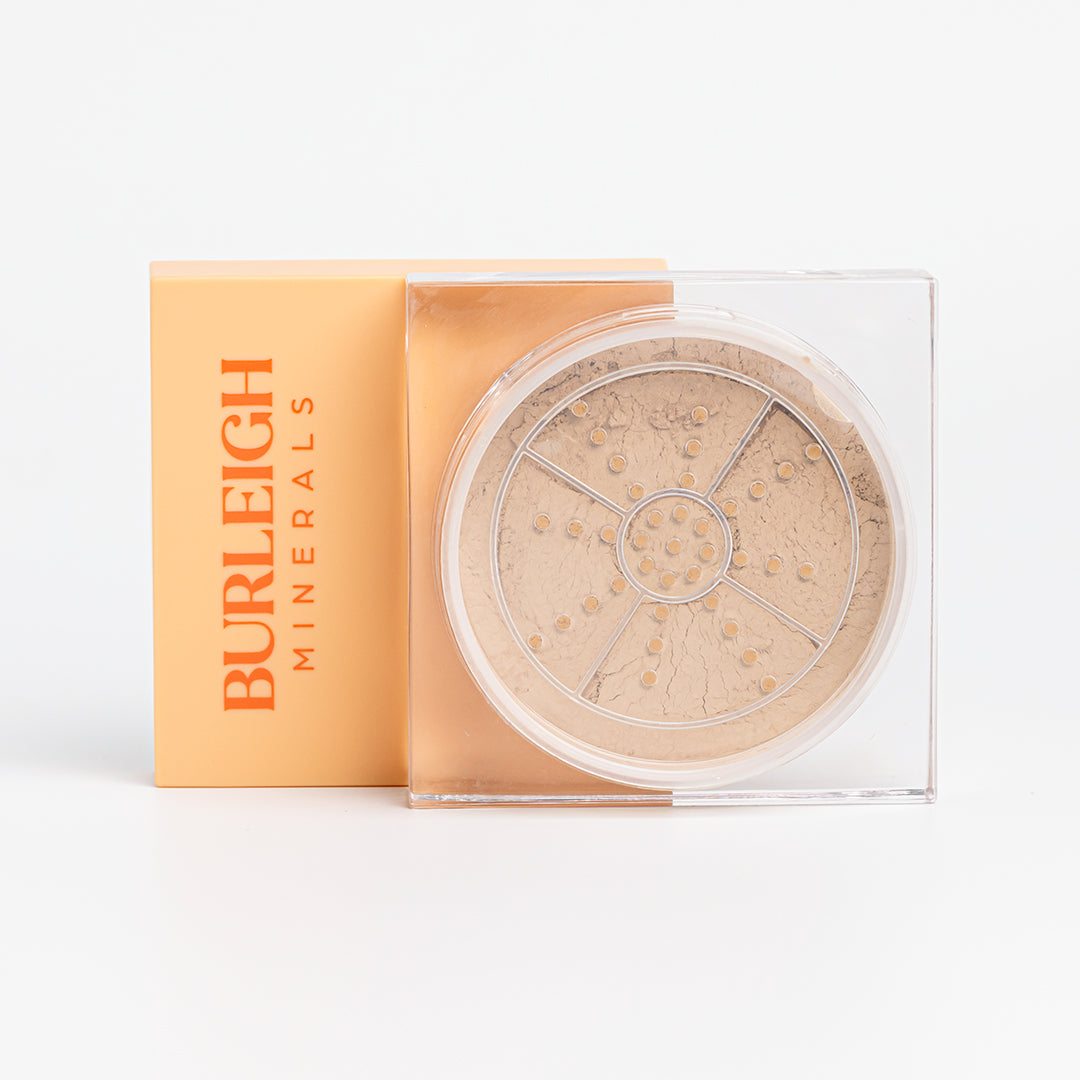 Clear container of mineral foundation powder in the 270 summer tan with a pastel orange lid, photographed against a white background.